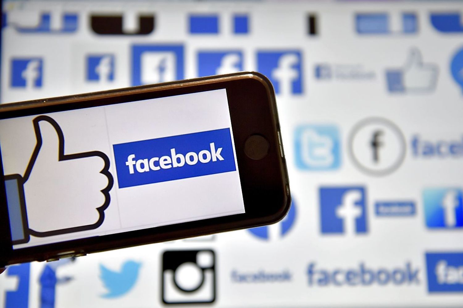 (FILES) This file photo taken on February 08, 2017 shows logos of US online social media and social networking service Facebook in Vertou, western France. Facebook on Februaru 10, 2017 promised an outside audit of data it provides advertisers in a move apparently aimed at quelling concerns about accuracy. The news came just months after the leading social network announced it was working to fix flaws in its metrics calculations that led to audiences being overestimated at times. / AFP PHOTO / LOIC VENANCE